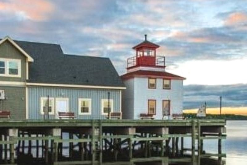 The replica lighthouse on the wharf at dusk
